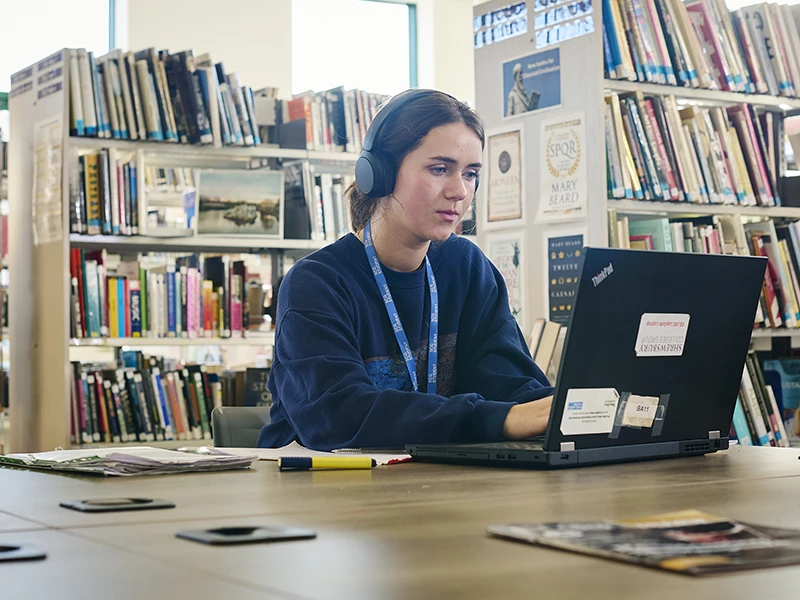 Student on laptop in the Learning Resources Centre at English Bridge