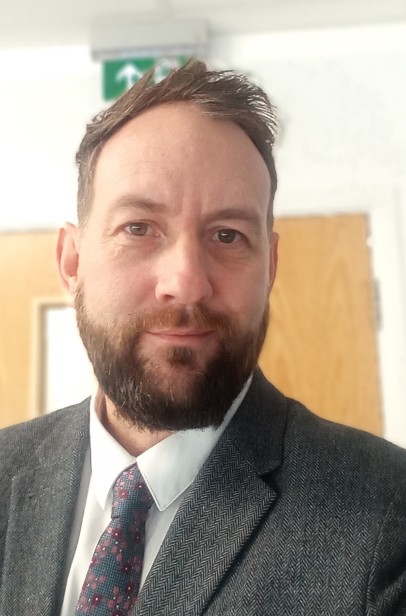 Head and shoulders photo of Matt Laws wearing a suit