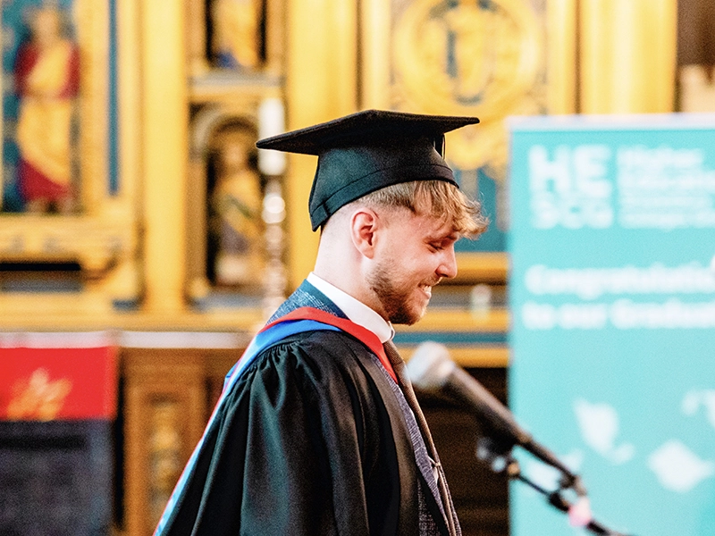 Student sawing metal