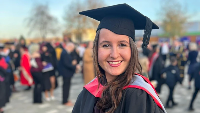 Student wearing cap and gown