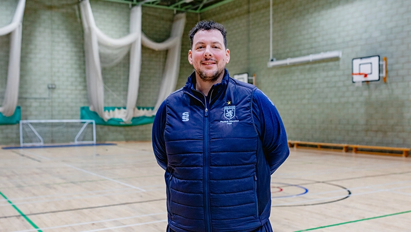 Man standing in sports hall