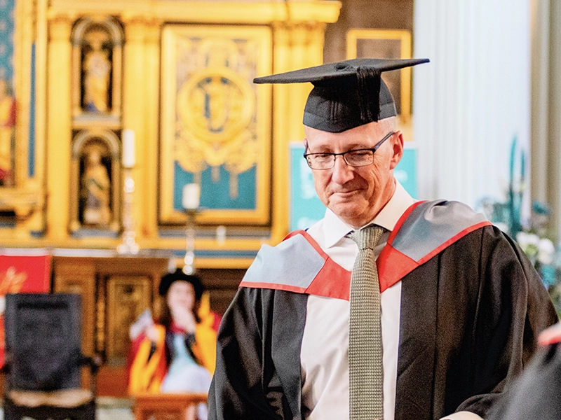 Student sawing metal