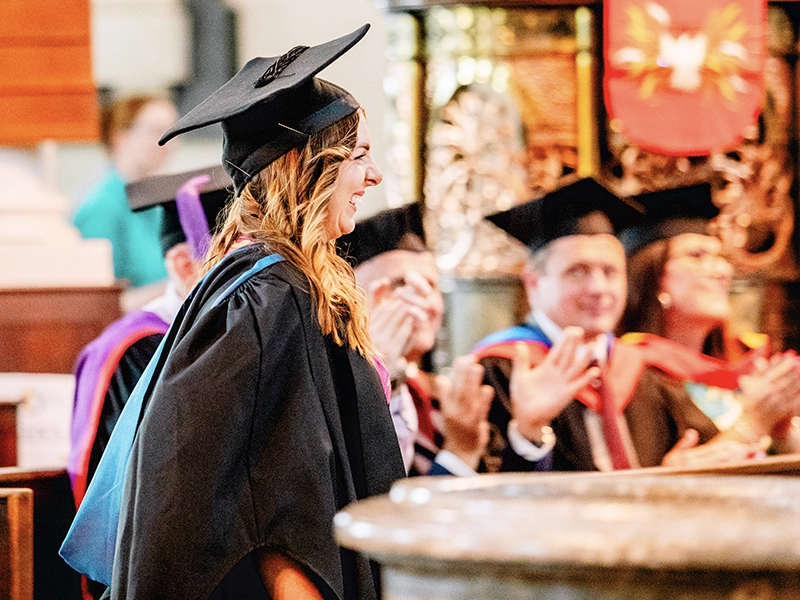 Student sawing metal