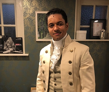 Student standing in costume