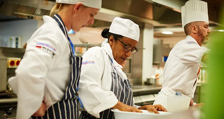 Staff and student in kitchen