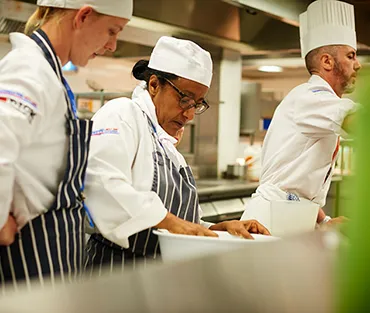 Staff and student in kitchen