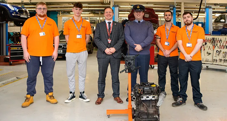 Four Engineering Apprentices standing next to Curriculum leader and Pilot Officer