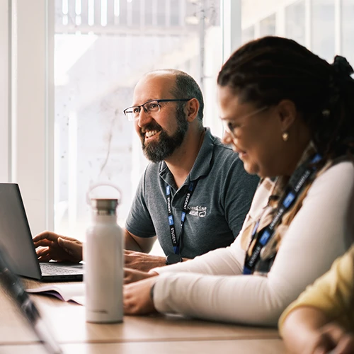 Two adults in a classroom