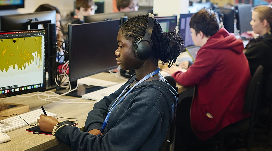 Student creating artwork using digital pen