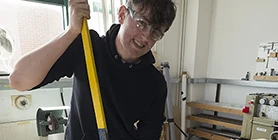 Student with laptop in library